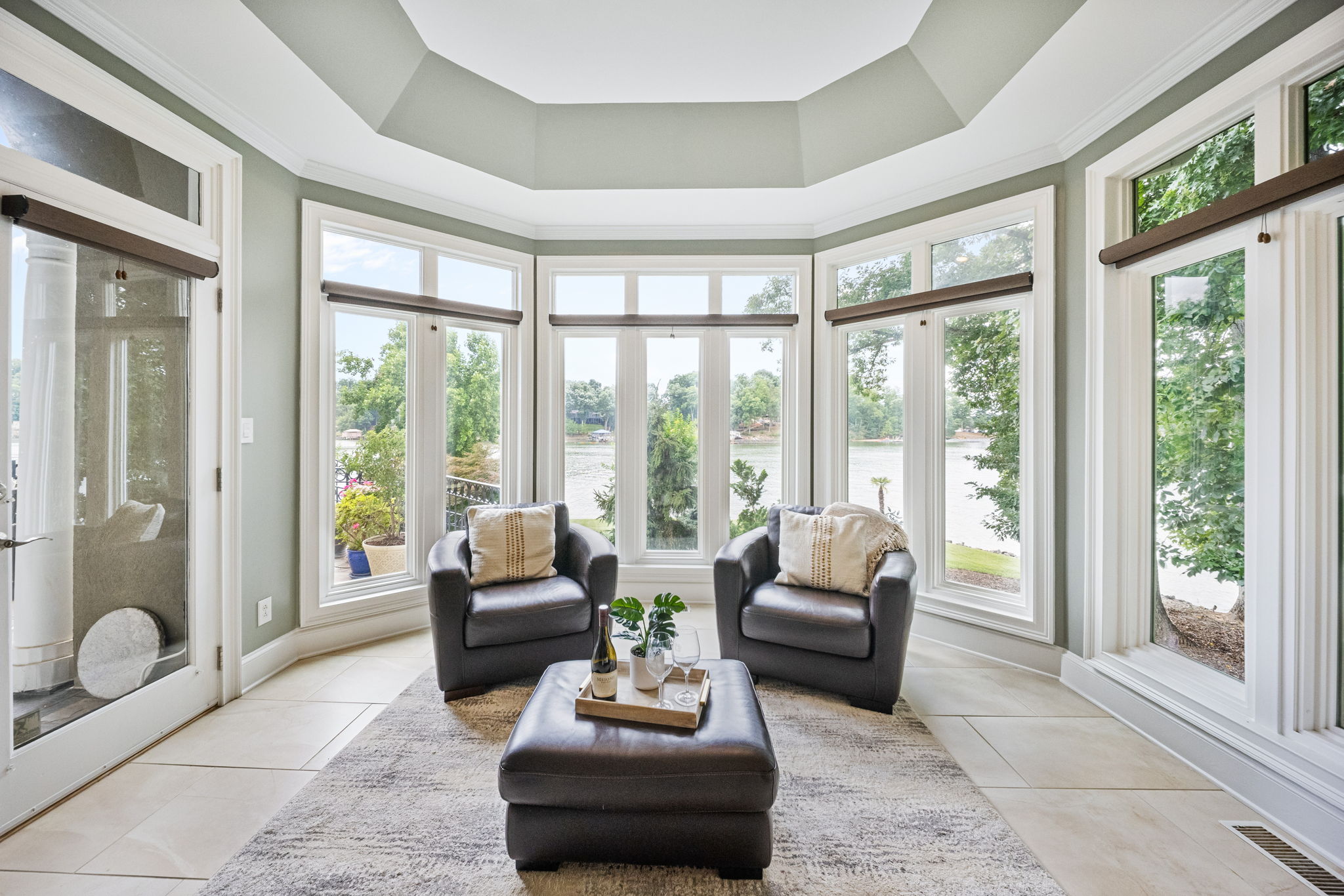 Sunlit sitting room with octagonal tray ceiling overlooking Lake Wylie